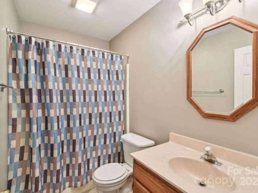 36 Queen Road, Candler, NC 28715.  MLS# CAR4245430, YatesRealty ID 19231. Guest Bath