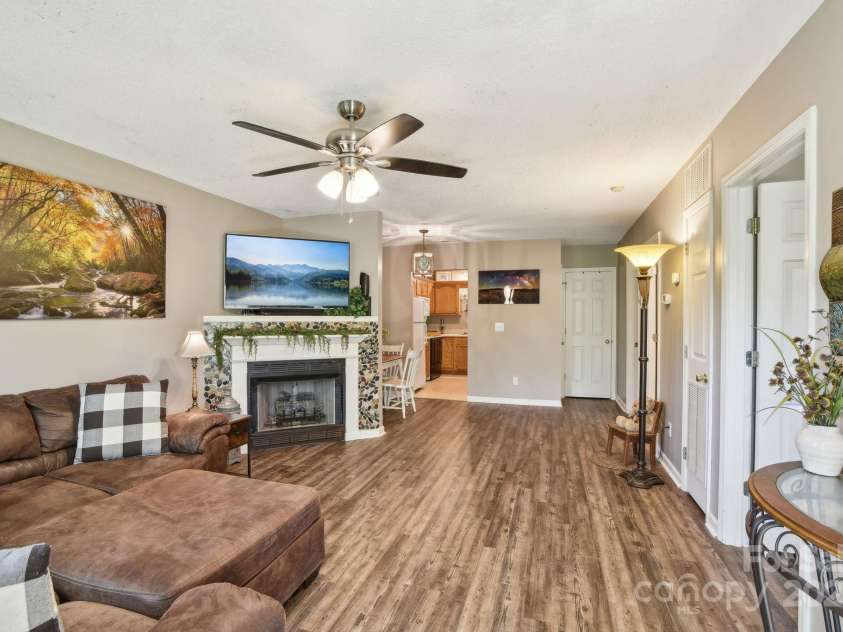 36 Queen Road, Candler, NC 28715.  MLS# CAR4245430, YatesRealty ID 19231. Living area w/ fireplace