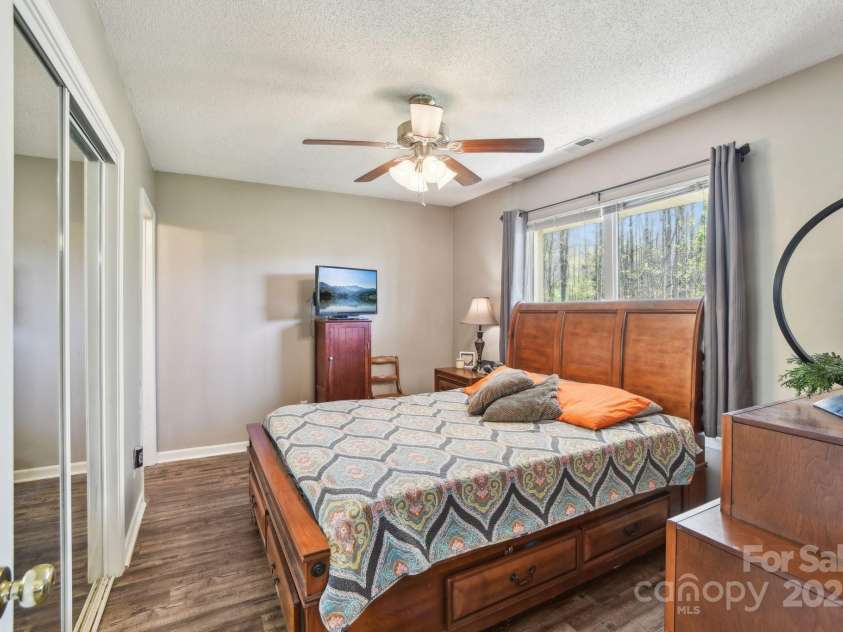 36 Queen Road, Candler, NC 28715.  MLS# CAR4245430, YatesRealty ID 19231. Primary Bedroom