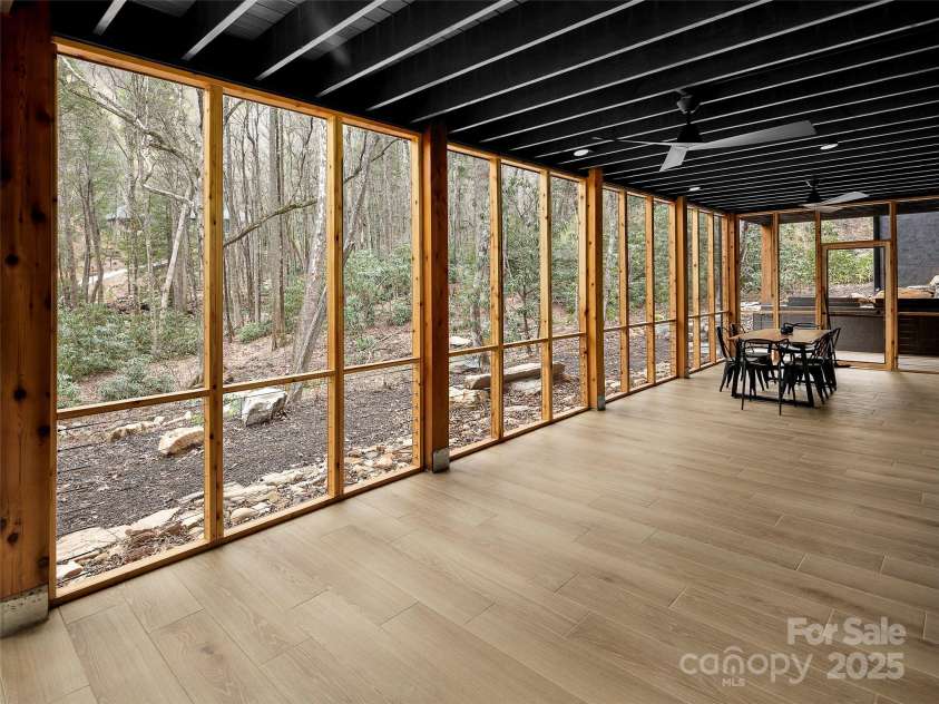 80 Hemlock Circle, Black Mountain, NC 28711.  MLS# CAR4252035, YatesRealty ID 19236. Downstairs porch with fans and heaters