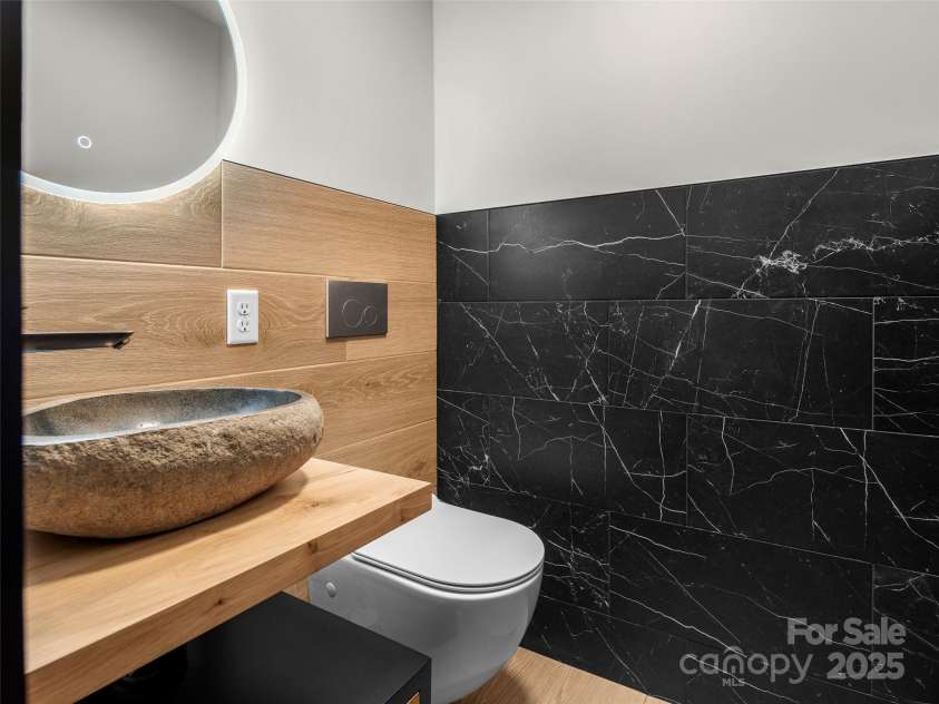 80 Hemlock Circle, Black Mountain, NC 28711.  MLS# CAR4252035, YatesRealty ID 19236. Downstairs Water Closet