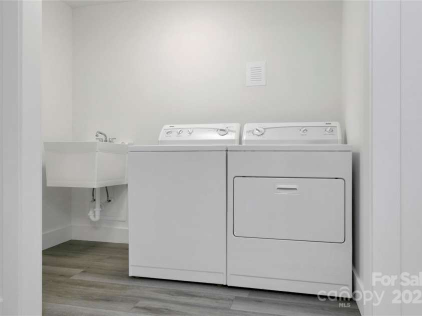 181 Pleasant Hill Drive, Brevard, NC 28712.  MLS# CAR4247052, YatesRealty ID 19238. New Laundry Room With Dump Sink. Washer/Dryer Included