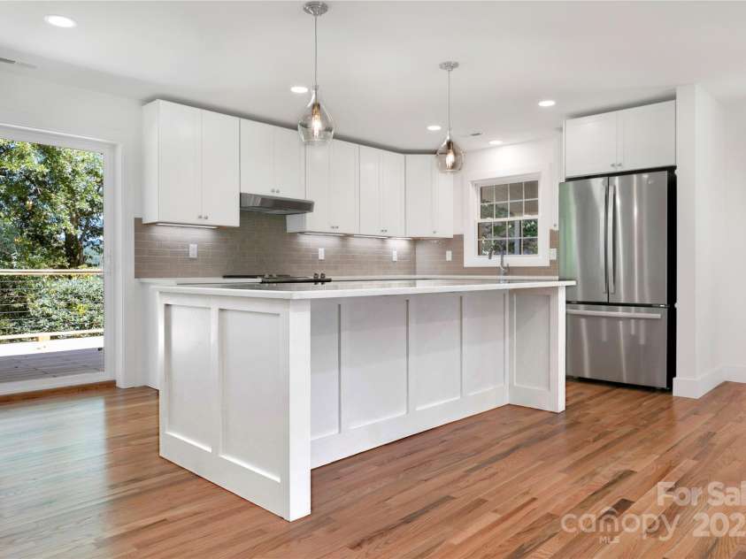181 Pleasant Hill Drive, Brevard, NC 28712.  MLS# CAR4247052, YatesRealty ID 19238. New Modern Kitchen With Sliders Connecting You To Your Back Deck.