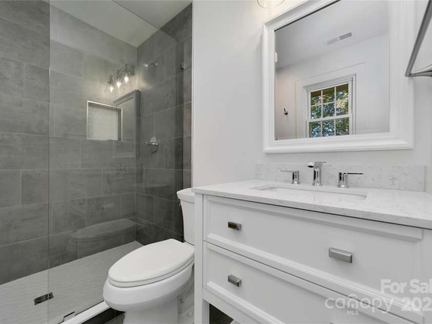 181 Pleasant Hill Drive, Brevard, NC 28712.  MLS# CAR4247052, YatesRealty ID 19238. New Modern Primary Bathroom With Frameless Glass Wall