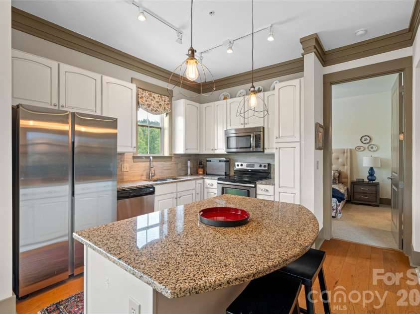 42 Schenck Parkway, Asheville, NC 28803.  MLS# CAR4413067, YatesRealty ID 1924. Ample Cabinetry with Breakfast Bar