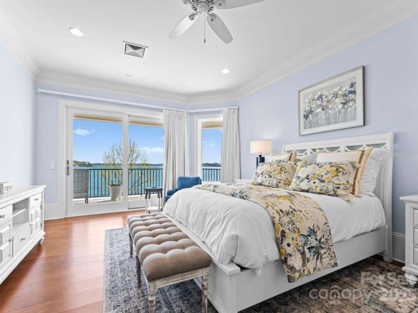 8228 Bay Pointe Drive, Denver, NC 28037.  MLS# CAR4238879, YatesRealty ID 19243. Ensuite Bedroom with private balcony to unwind to sensational water views!
