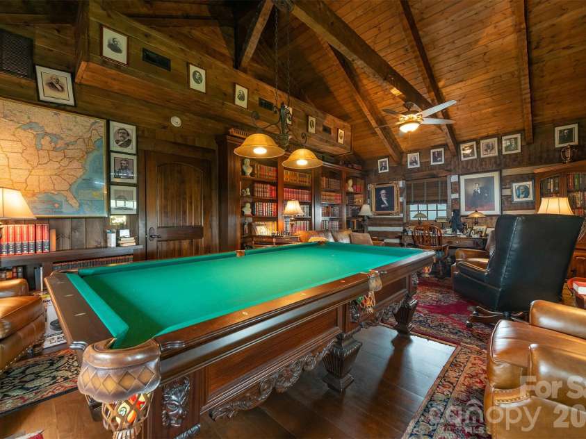 143 Daniel Boone Trail, Burnsville, NC 28714.  MLS# CAR4261449, YatesRealty ID 1925. Amazing built-in wood shelves are perfect for the avid reader