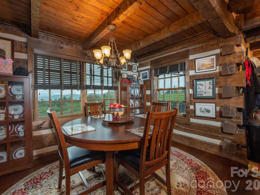 143 Daniel Boone Trail, Burnsville, NC 28714.  MLS# CAR4261449, YatesRealty ID 1925. Dining room looks out towards Mt. Mitchell
