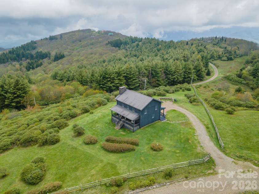 143 Daniel Boone Trail, Burnsville, NC 28714.  MLS# CAR4261449, YatesRealty ID 1925. Magical home overlooking the Great Smokey Mountains and Tennessee