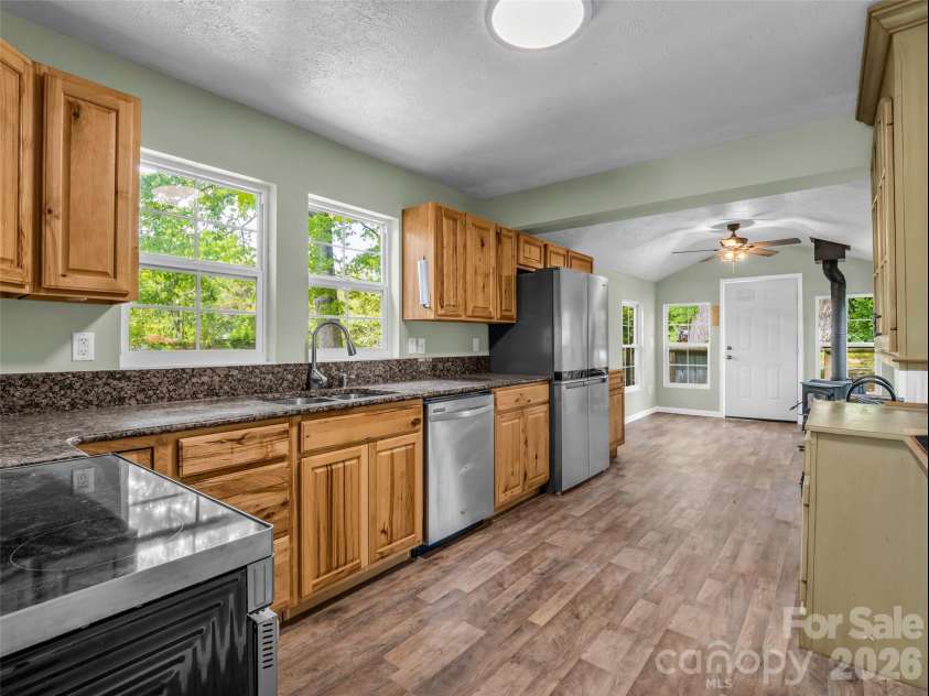 1916 Old Spartanburg Road, Hendersonville, NC 28792.  MLS# CAR4378885, YatesRealty ID 19254. Kitchen With Dining Area