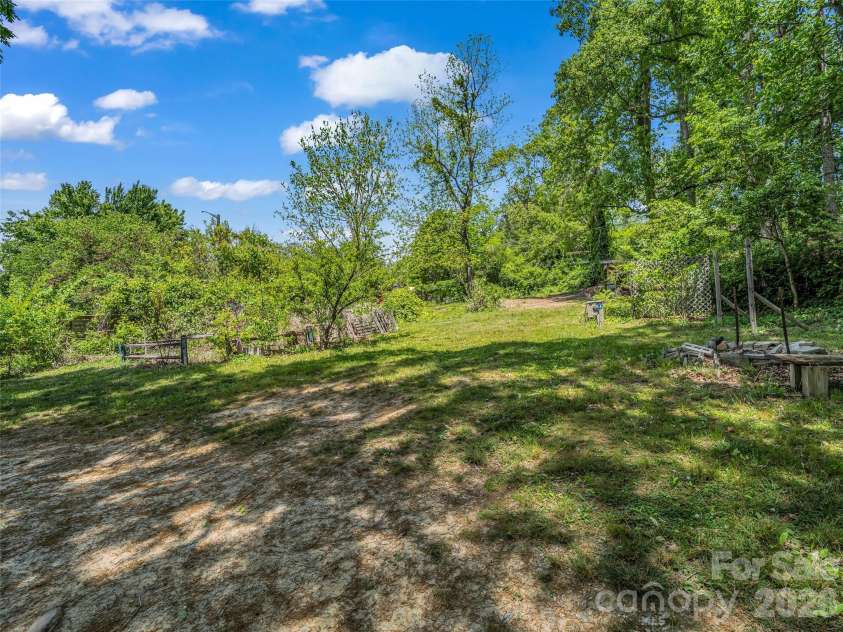 1916 Old Spartanburg Road, Hendersonville, NC 28792.  MLS# CAR4378885, YatesRealty ID 19254. Spacious Backyard!