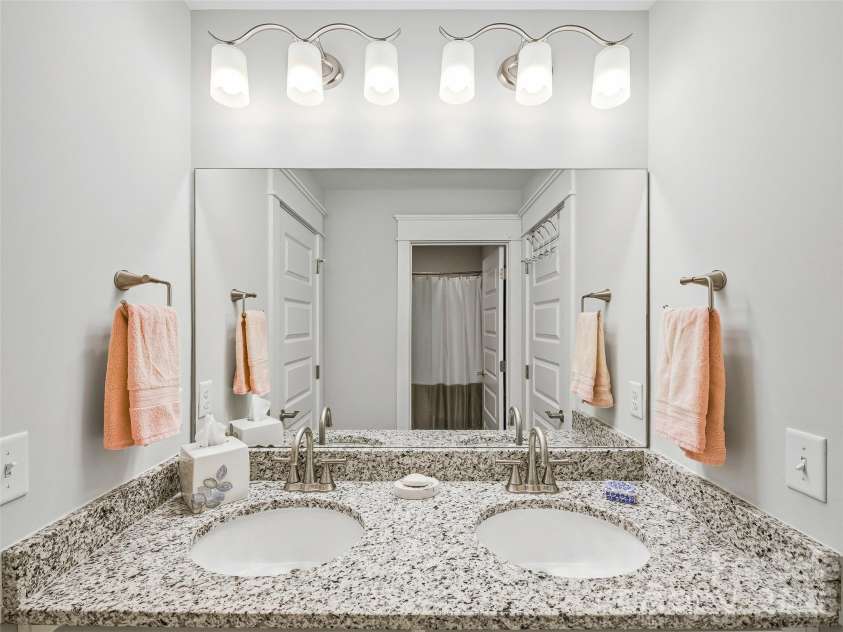 205 Weybridge Drive, Arden, NC 28704.  MLS# CAR4366273, YatesRealty ID 19255. Guest Bathroom with double vanities