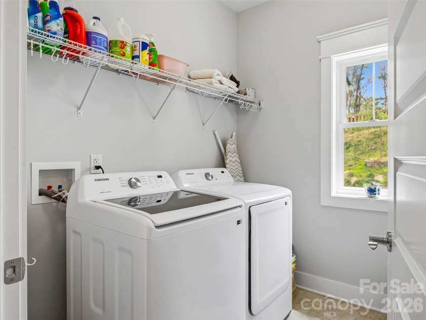 205 Weybridge Drive, Arden, NC 28704.  MLS# CAR4366273, YatesRealty ID 19255. Laundry Room right off the kitchen