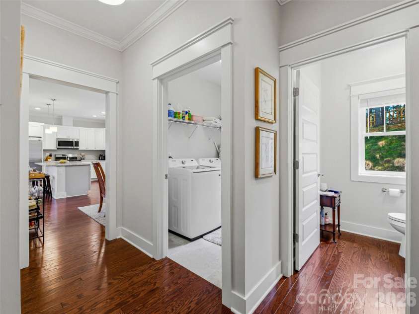 205 Weybridge Drive, Arden, NC 28704.  MLS# CAR4366273, YatesRealty ID 19255. Powder Room & Laundry right off the kitchen