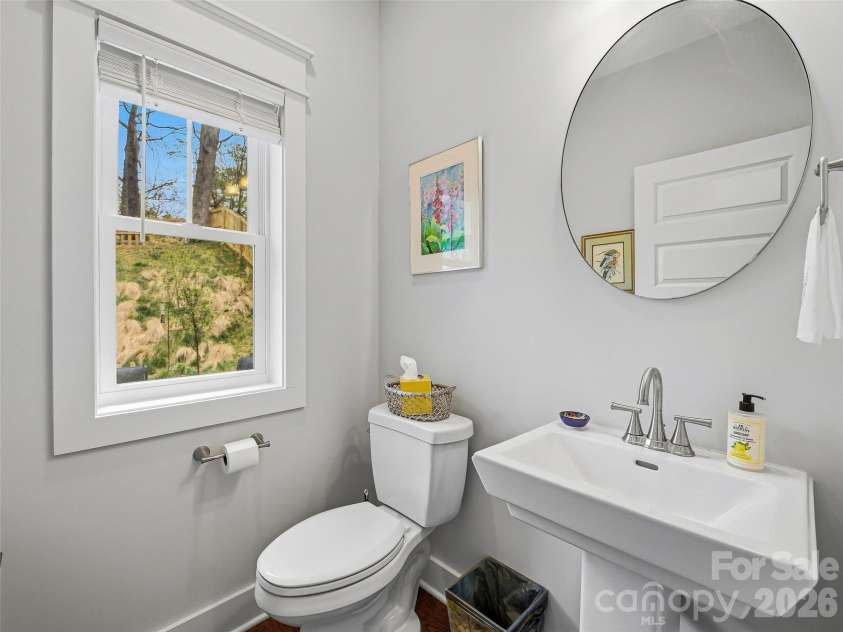 205 Weybridge Drive, Arden, NC 28704.  MLS# CAR4366273, YatesRealty ID 19255. Powder Room right off the kitchen