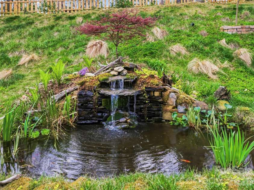 205 Weybridge Drive, Arden, NC 28704.  MLS# CAR4366273, YatesRealty ID 19255. Water feature