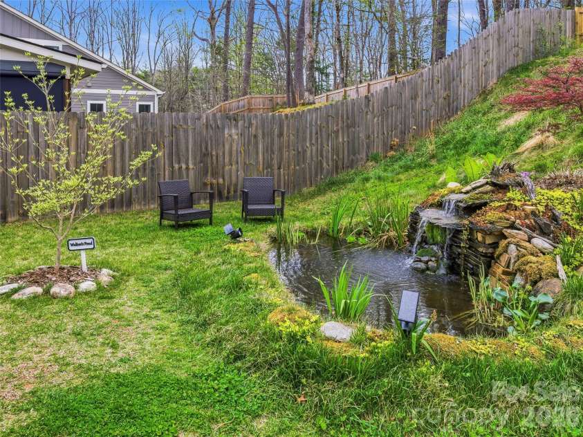 205 Weybridge Drive, Arden, NC 28704.  MLS# CAR4366273, YatesRealty ID 19255. Water feature