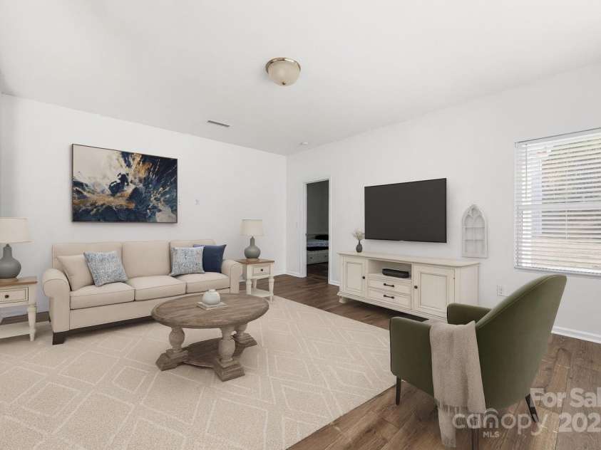 723 Yorkshire Drive, Albemarle, NC 28001.  MLS# CAR4314310, YatesRealty ID 1926. Virtually staged family room