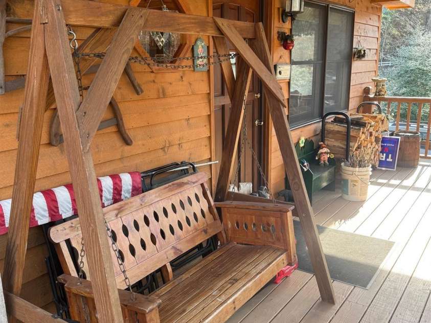 315 River Road, Sylva, NC 28779.  MLS# CAR4365027, YatesRealty ID 19267. Covered area is great for enjoying a beverage and the view.