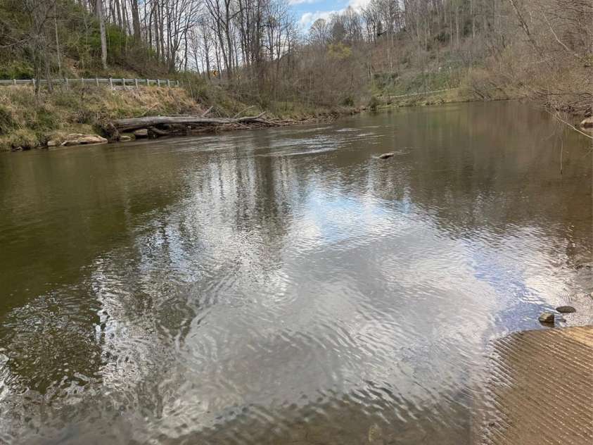 315 River Road, Sylva, NC 28779.  MLS# CAR4365027, YatesRealty ID 19267. View of river from park looking down to cabin
