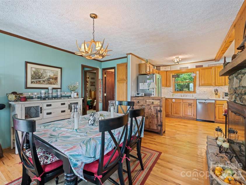 724 Pless Underwood Road, Maggie Valley, NC 28751.  MLS# CAR4268865, YatesRealty ID 19270. Dining room & kitchen