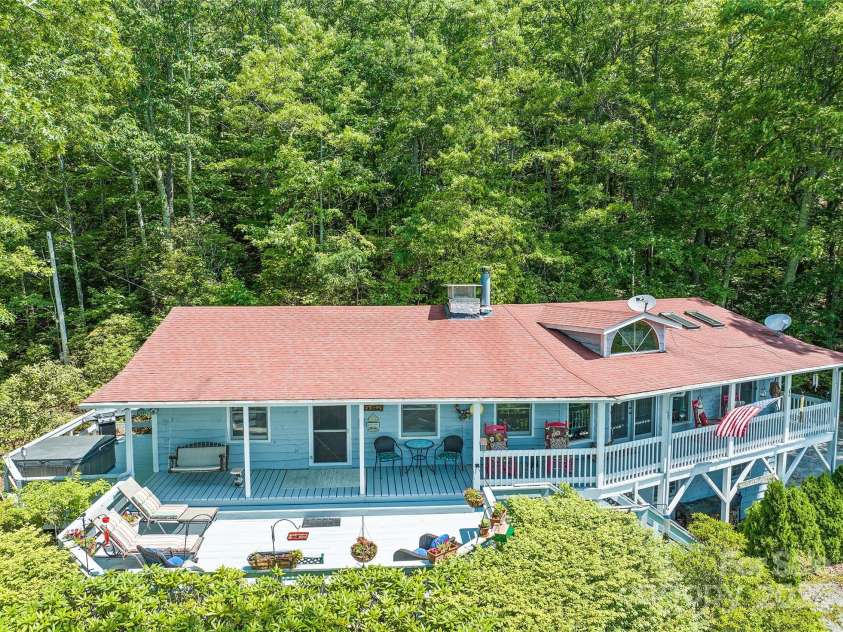 724 Pless Underwood Road, Maggie Valley, NC 28751.  MLS# CAR4268865, YatesRealty ID 19270. Expansive covered porches and open decks