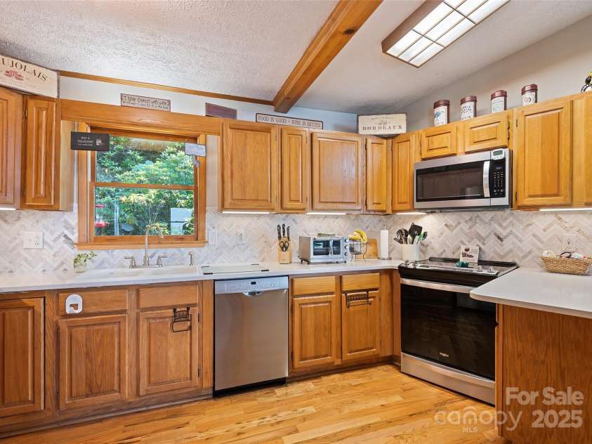 724 Pless Underwood Road, Maggie Valley, NC 28751.  MLS# CAR4268865, YatesRealty ID 19270. Kitchen; another angle