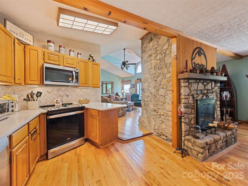 724 Pless Underwood Road, Maggie Valley, NC 28751.  MLS# CAR4268865, YatesRealty ID 19270. Kitchen & living room