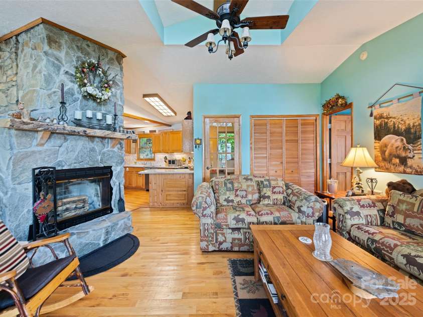 724 Pless Underwood Road, Maggie Valley, NC 28751.  MLS# CAR4268865, YatesRealty ID 19270. Living room & kitchen
