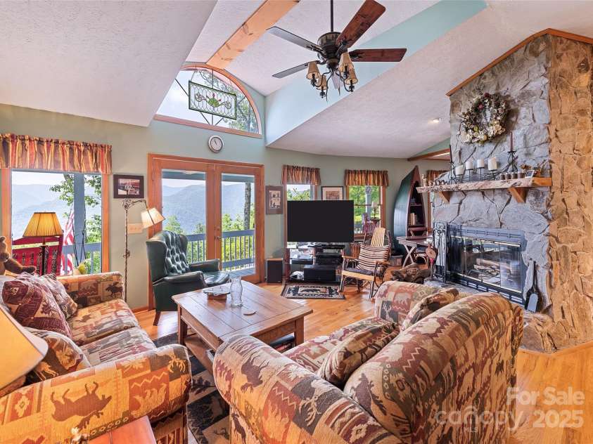 724 Pless Underwood Road, Maggie Valley, NC 28751.  MLS# CAR4268865, YatesRealty ID 19270. Living room; with fireplace...plenty of natural light