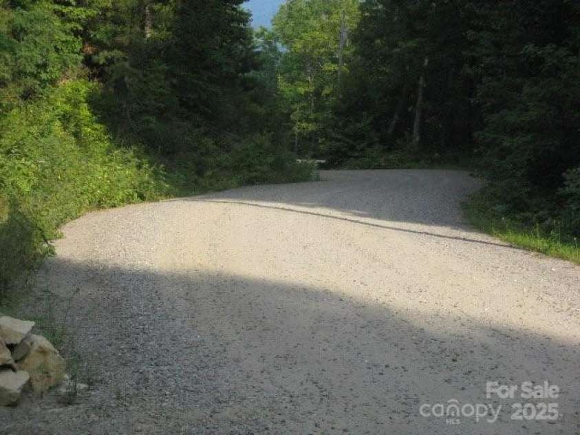 724 Pless Underwood Road, Maggie Valley, NC 28751.  MLS# CAR4268865, YatesRealty ID 19270. Wide gravel roads; maintained by POA