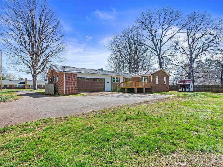 1212 3rd Street Drive, Conover, NC 28613.  MLS# CAR4357523, YatesRealty ID 19276. Focused Rear View (Reference Lot Line Overlay for approximate property line view) 