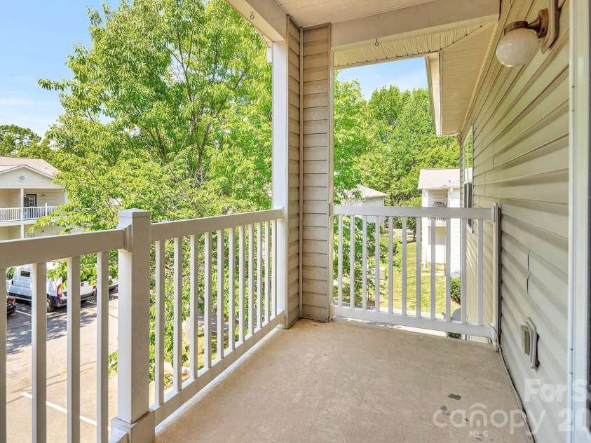 21232 Hickory Street, Cornelius, NC 28031.  MLS# CAR4372150, YatesRealty ID 19280. Back Covered Porch/Balcony