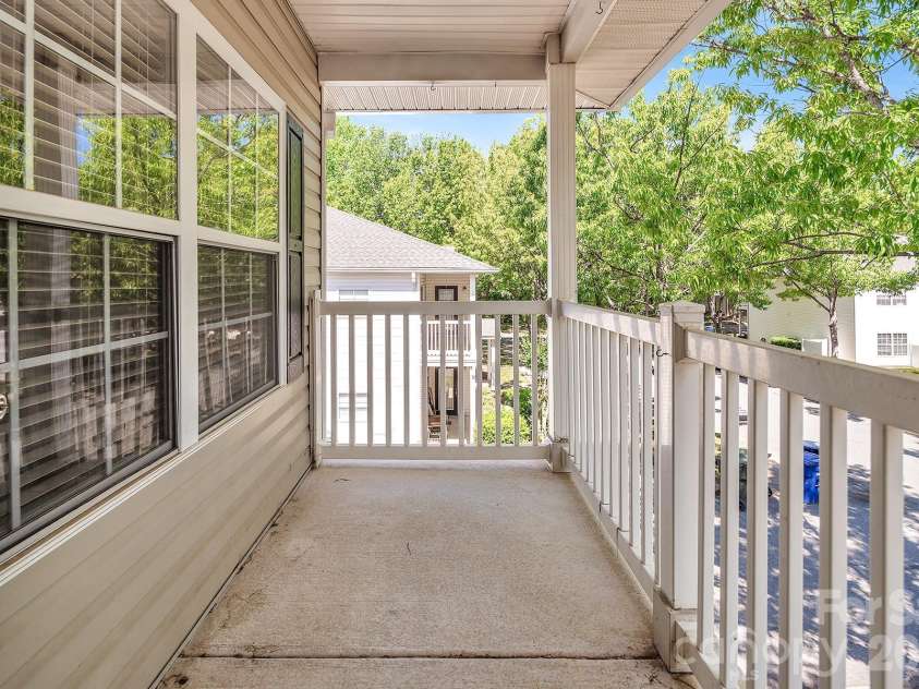 21232 Hickory Street, Cornelius, NC 28031.  MLS# CAR4372150, YatesRealty ID 19280. Front Covered Porch/Balcony