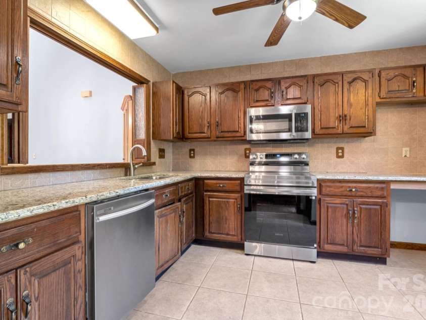 3104 Cove Loop Road, Hendersonville, NC 28739.  MLS# CAR4362842, YatesRealty ID 19289. Ample cabinetry, and functional layout.