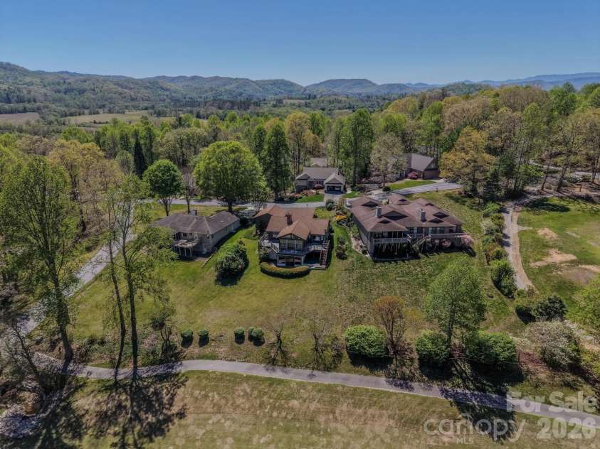 3104 Cove Loop Road, Hendersonville, NC 28739.  MLS# CAR4362842, YatesRealty ID 19289. Elevated rear perspective highlighting yard space and layout
