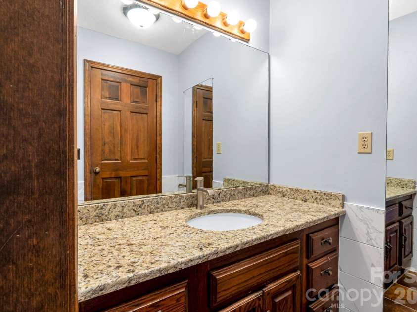 3104 Cove Loop Road, Hendersonville, NC 28739.  MLS# CAR4362842, YatesRealty ID 19289. Full bathroom featuring clean finishes and functional layout