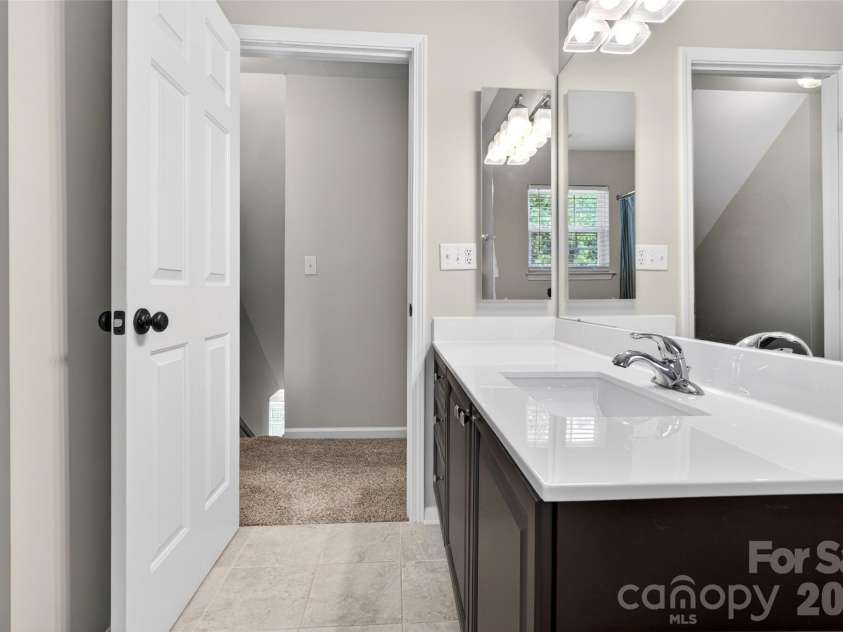 118 Easy Street, Mooresville, NC 28117.  MLS# CAR4367530, YatesRealty ID 19291. Ample storage in the large vanity cabinet