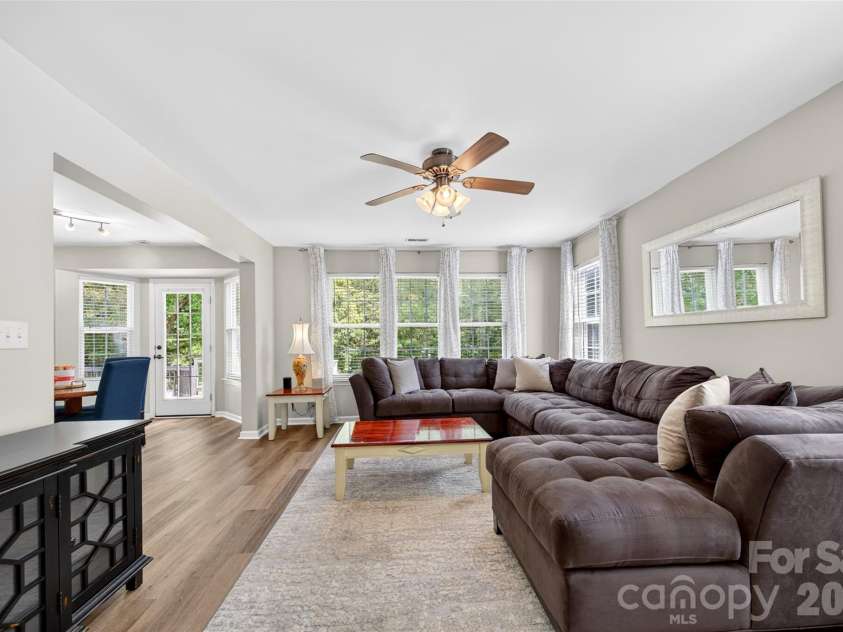 118 Easy Street, Mooresville, NC 28117.  MLS# CAR4367530, YatesRealty ID 19291. Family Room overlooks the backyard and greenway