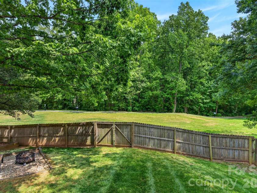 118 Easy Street, Mooresville, NC 28117.  MLS# CAR4367530, YatesRealty ID 19291. Fenced in Backyard with firepit and gate to the Greenway!