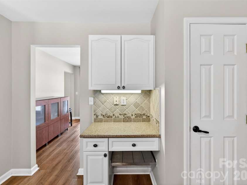 118 Easy Street, Mooresville, NC 28117.  MLS# CAR4367530, YatesRealty ID 19291. Looking into the formal Dining Room, notice the Pantry and convenient Kitchen Desk area.