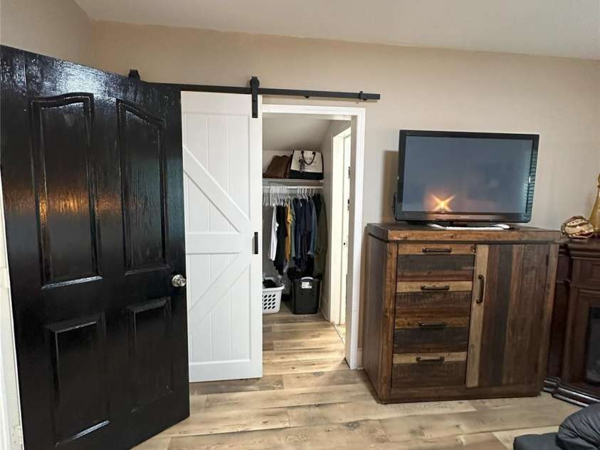 918 8th Street, Lancaster, SC 29720.  MLS# CAR4258471, YatesRealty ID 19301. Barn Door leading to closet and Primary Bath