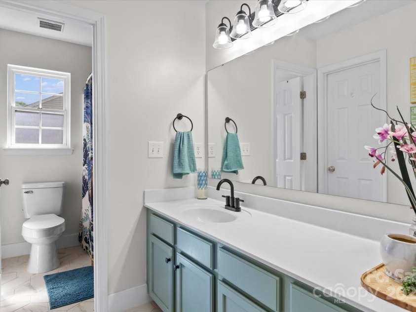 176 Pleasant Grove Lane, Mooresville, NC 28115.  MLS# CAR4259167, YatesRealty ID 19306. Upstairs Bathroom 2