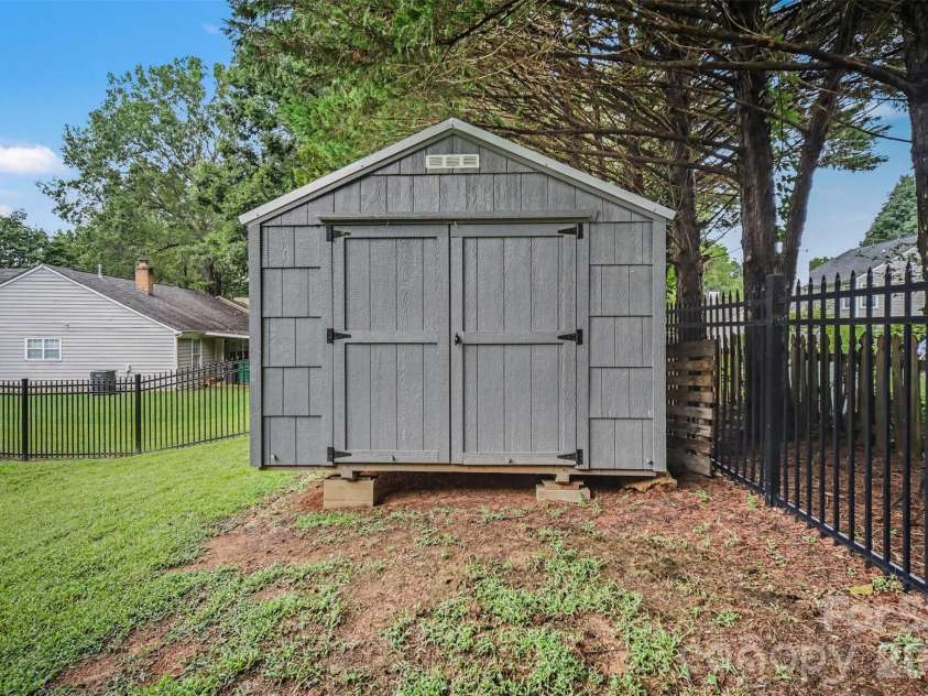 8500 Woodhill Manor Court, Charlotte, NC 28215.  MLS# CAR4417739, YatesRealty ID 19307. Backyard Storage Building