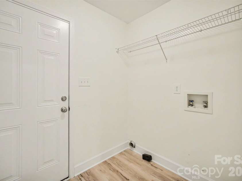 8500 Woodhill Manor Court, Charlotte, NC 28215.  MLS# CAR4417739, YatesRealty ID 19307. Laundry Room and exit to garage