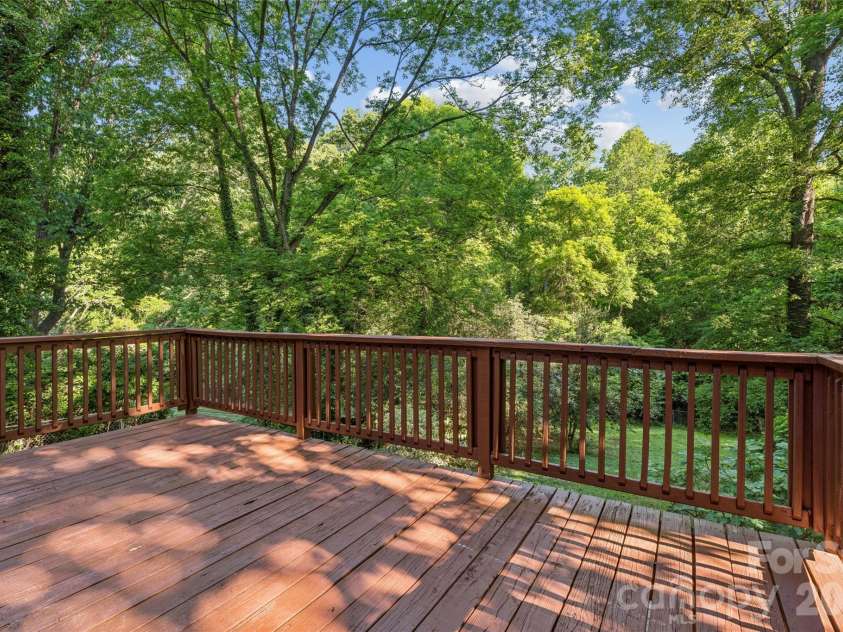 2227 Wensley Drive, Charlotte, NC 28210.  MLS# CAR4376969, YatesRealty ID 19311. Fully shaded rear deck to enjoy your private park