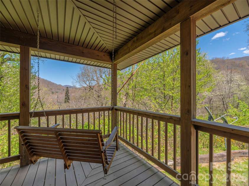 240 Plott Balsam Road, Maggie Valley, NC 28751.  MLS# CAR4374261, YatesRealty ID 19334. Wraparound porch