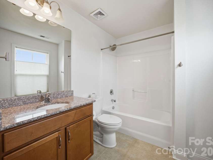 7223 Old Valley Way, Harrisburg, NC 28075.  MLS# CAR4378364, YatesRealty ID 19342. Private Guest bath attached to bedroom