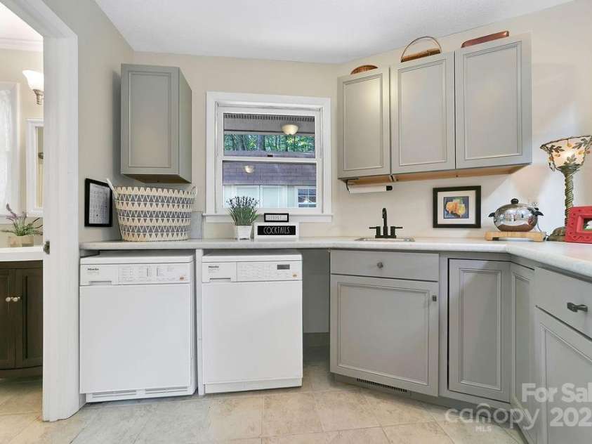 1005 Middle Connestee Trail, Brevard, NC 28712.  MLS# CAR4269691, YatesRealty ID 19349. Storage & space for other tasks in the laundry area