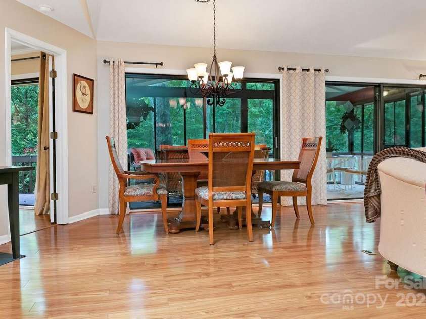 1005 Middle Connestee Trail, Brevard, NC 28712.  MLS# CAR4269691, YatesRealty ID 19349. The dining area enjoys  views of the forest